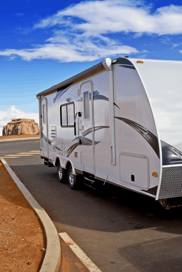 White travel trailer RV parked in a free overnight parking spot