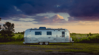 Airstream trailer for rent parked at campsite