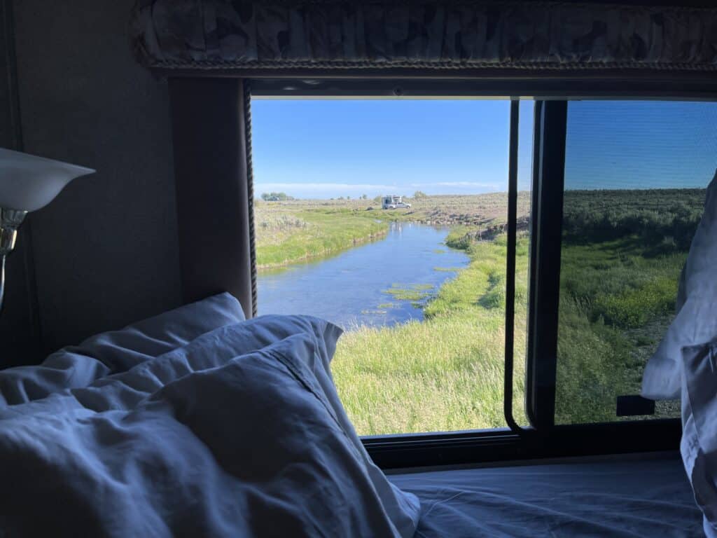 looking out RV window at boondocking location